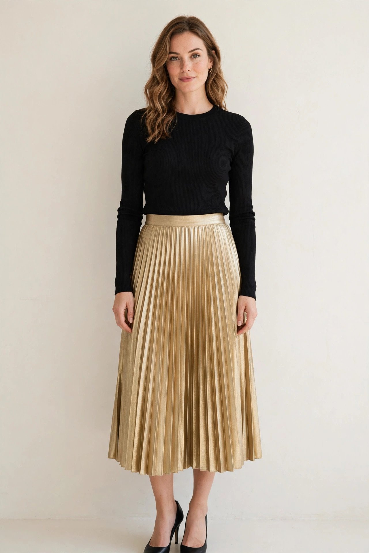 christmas party outfits - gold pleated skirt with black top