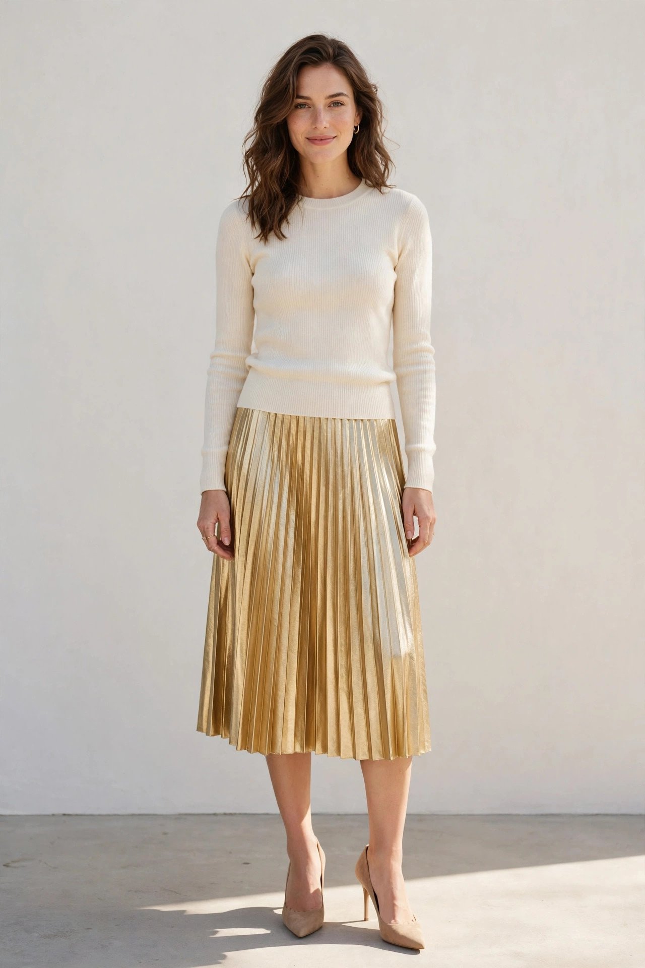 fall wedding guest outfits - gold pleated skirt and cream sweater