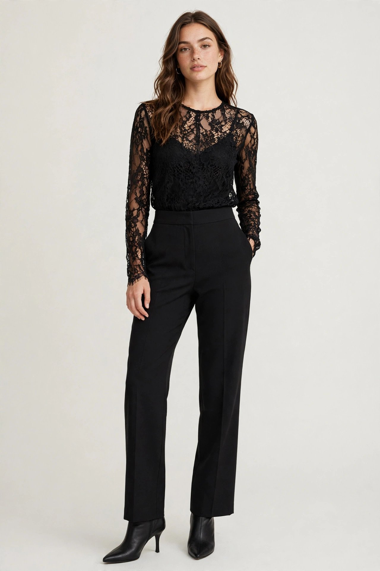 holiday party outfits - black lace top and high-waist black trousers
