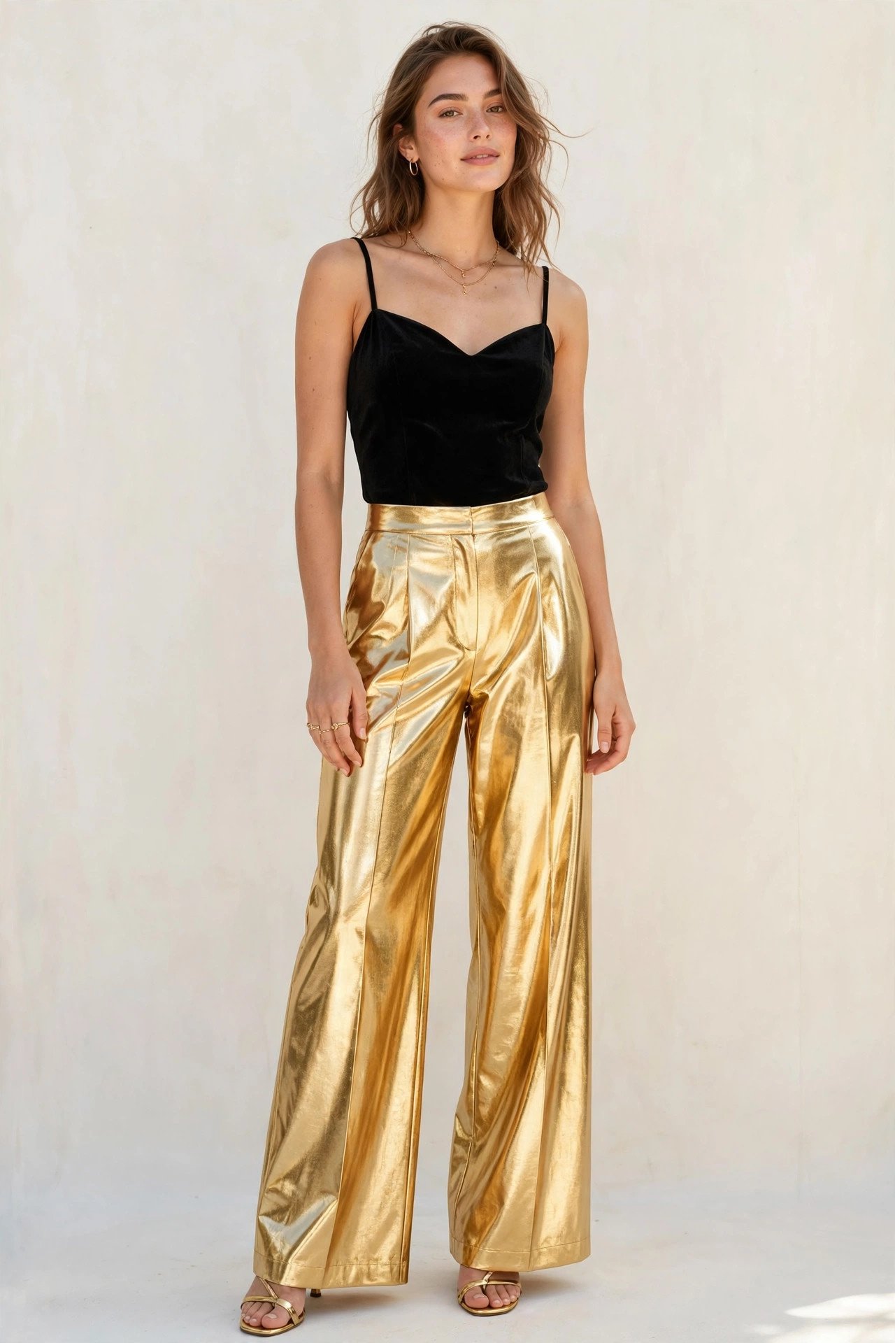 holiday party outfits - black velvet top and metallic gold pants