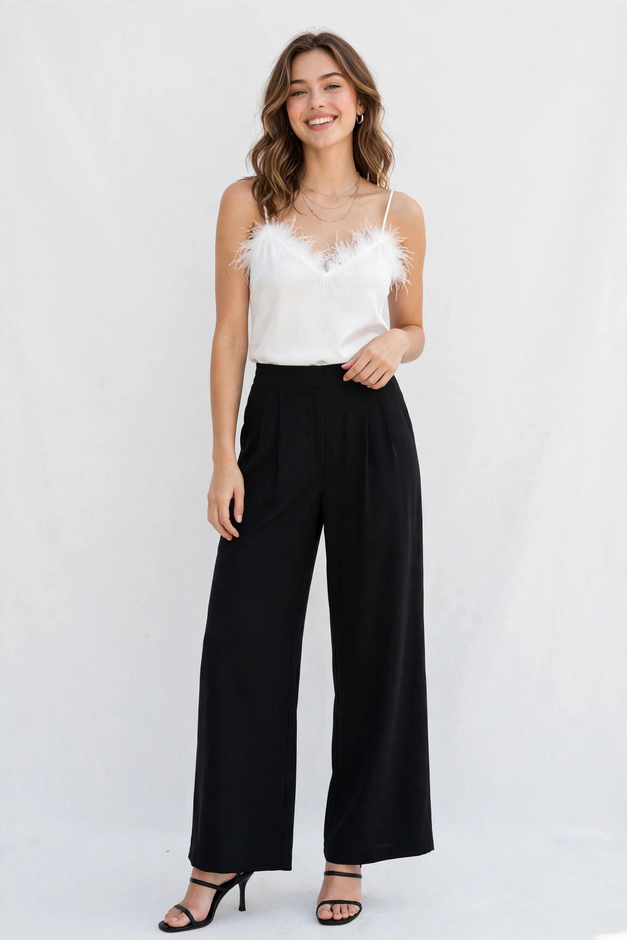 new year's eve outfits - white feather trim top with black pants