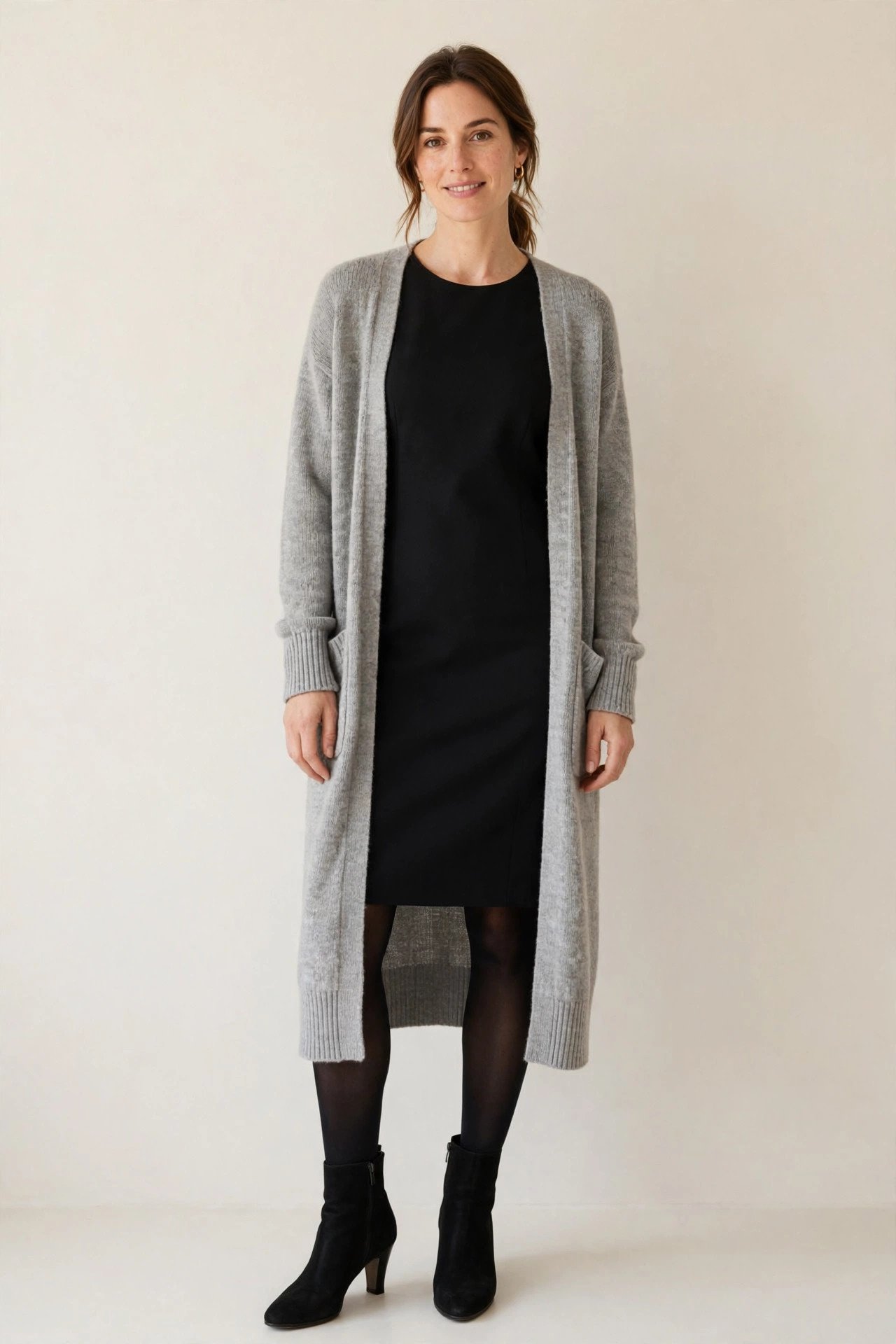 winter work outfits for women - black sheath dress with cardigan and tights